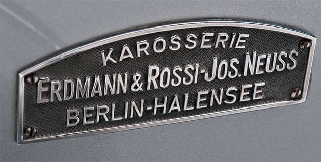 Erdmann & Rossi Plakette der 1930er-Jahre, mit Hinweis auf die übernommene Firma Jos. Neuss